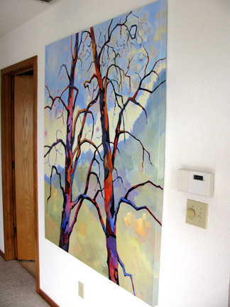 contemporary tree painting by Carolee Clark, "Companionship" hanging on the wall, side view